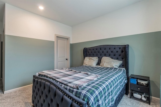 bedroom featuring light carpet