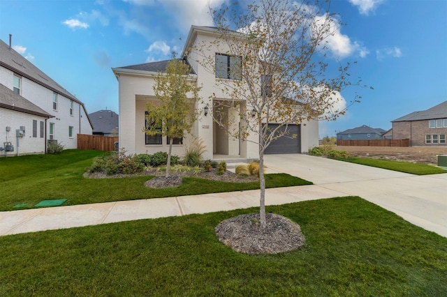 view of front of house with a front lawn and a garage