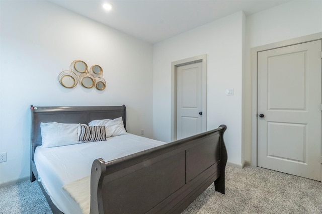 bedroom featuring light colored carpet