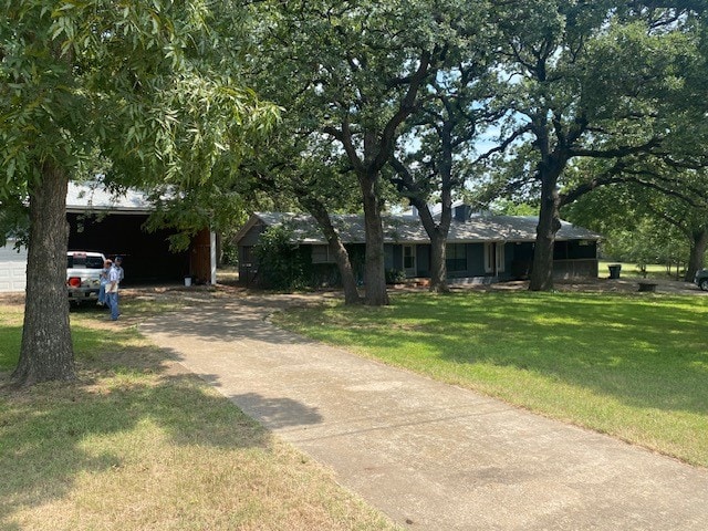 ranch-style home with a front yard