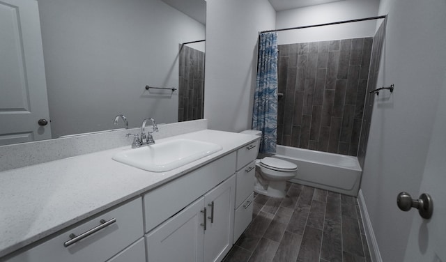 full bathroom featuring vanity, hardwood / wood-style flooring, toilet, and shower / bath combo with shower curtain