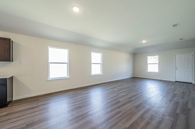 hallway with light hardwood / wood-style floors