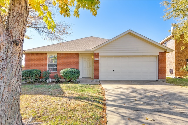 ranch-style home with a garage and a front lawn