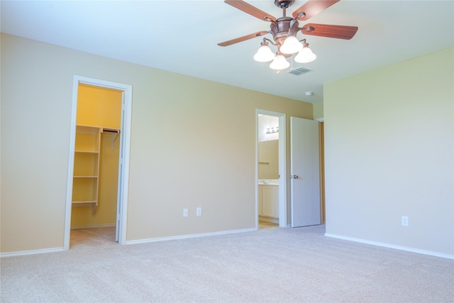 1303 Caroline Dr, Princeton, TX 75407 - unfurnished bedroom with a walk in closet, light colored carpet, a closet, and ensuite bathroom