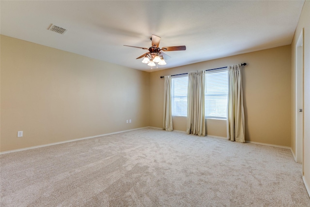 unfurnished room featuring ceiling fan and light colored carpet