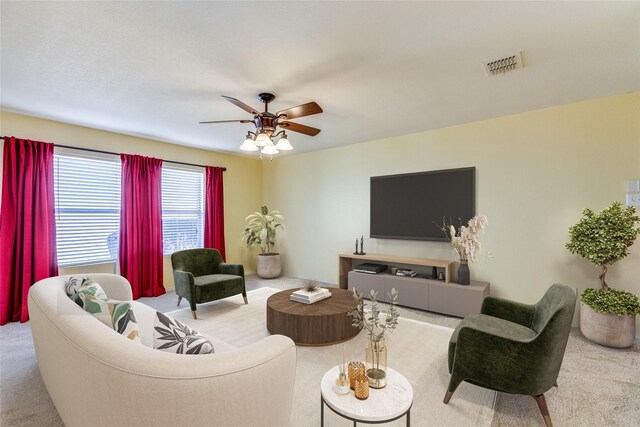 living room featuring ceiling fan and light carpet