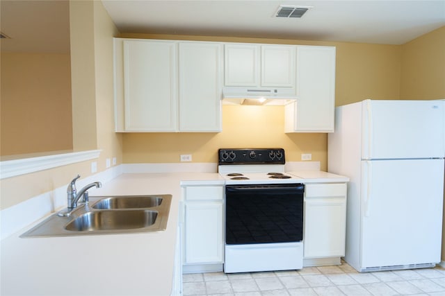 1303 Caroline Dr, Princeton, TX 75407 - kitchen featuring white appliances, under cabinet range hood, white cabinets, and light countertops