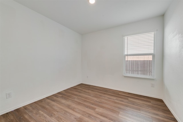 unfurnished room featuring light hardwood / wood-style flooring