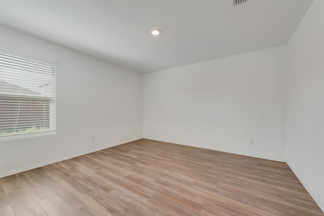 unfurnished room featuring light hardwood / wood-style flooring