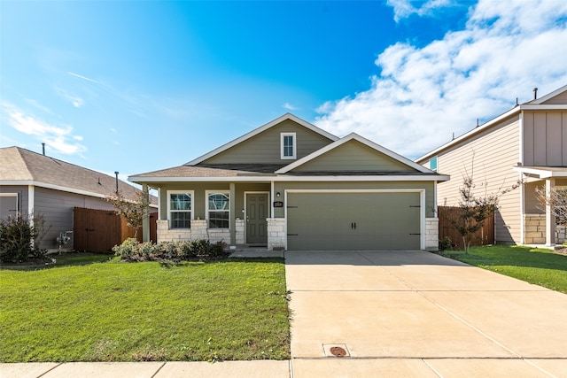 view of front of property featuring a garage and a front lawn