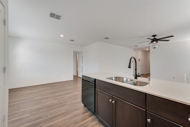 kitchen featuring dark brown cabinets, ceiling fan, sink, light hardwood / wood-style flooring, and dishwasher