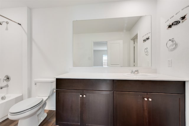 full bathroom featuring wood-type flooring, vanity, shower / bath combination, and toilet