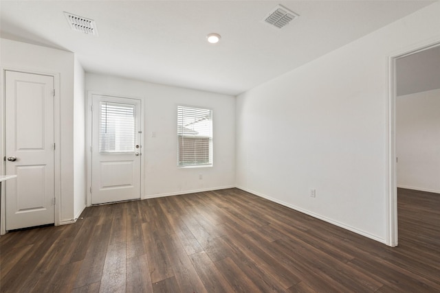 unfurnished room featuring dark hardwood / wood-style flooring