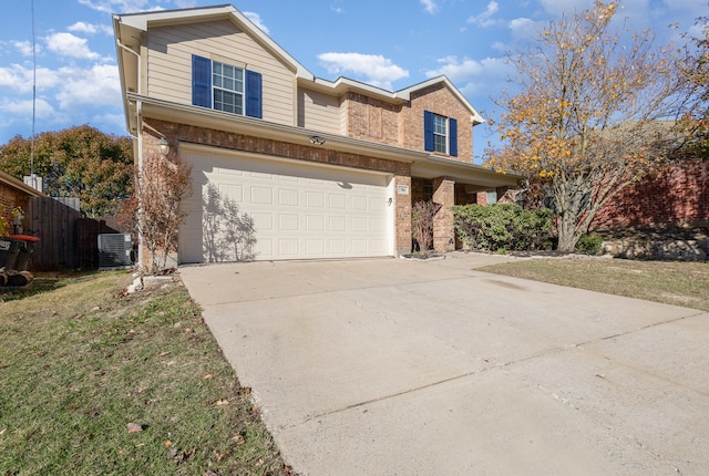 front of property featuring a garage and central air condition unit