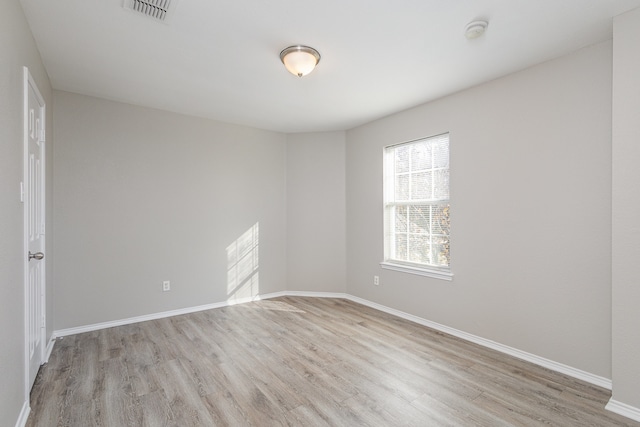 unfurnished room featuring light wood-type flooring