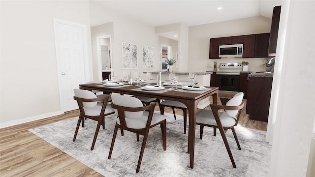 dining area with light wood-type flooring