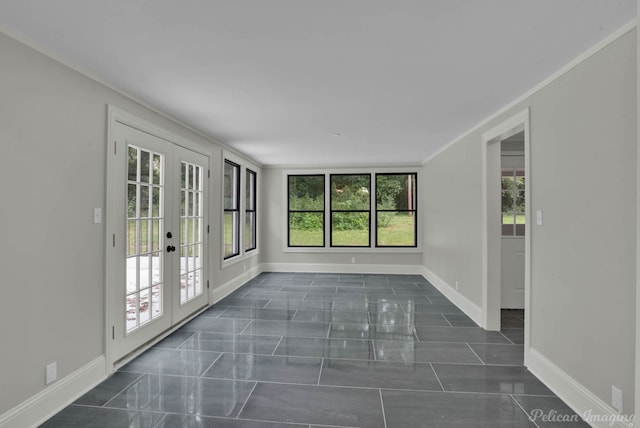 unfurnished sunroom with french doors