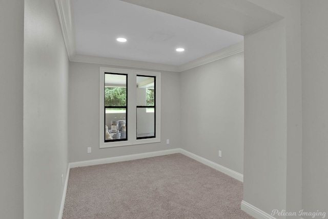 empty room with light carpet and ornamental molding