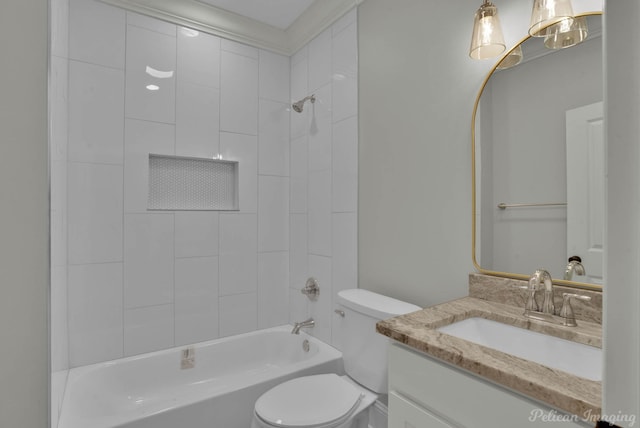 full bathroom featuring vanity, toilet, and tiled shower / bath