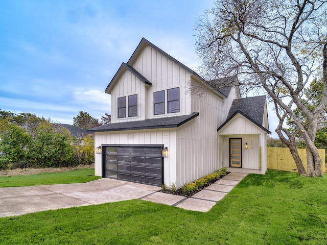 modern inspired farmhouse featuring a garage and a front lawn