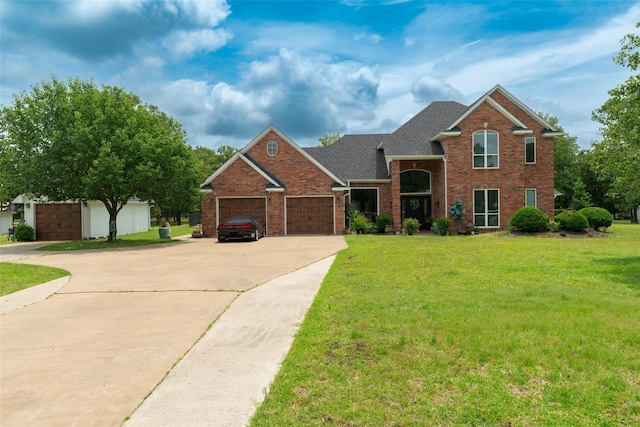 view of front of home with a garage and a front yard