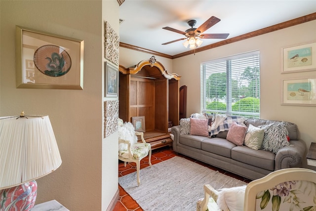 living room featuring tile patterned flooring, ceiling fan, and ornamental molding