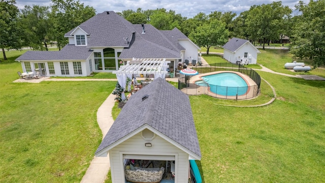 view of pool with a pergola, a lawn, and a patio area