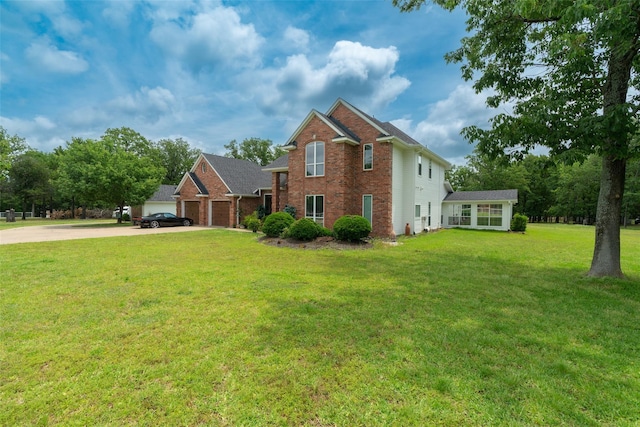 view of front of house featuring a garage and a front lawn