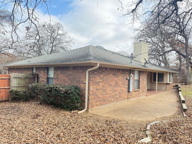 rear view of property featuring a patio