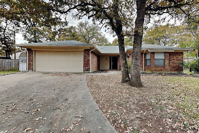 ranch-style house featuring a garage