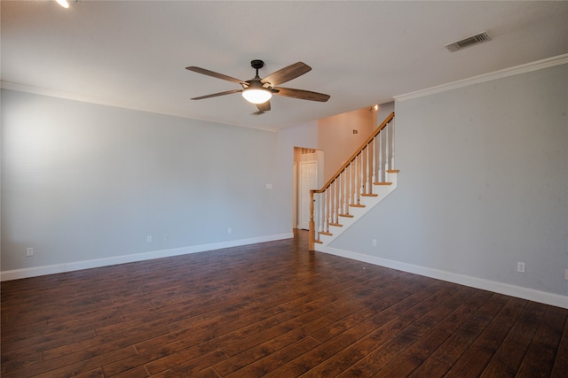 empty room with dark wood-type flooring, ornamental molding, and ceiling fan