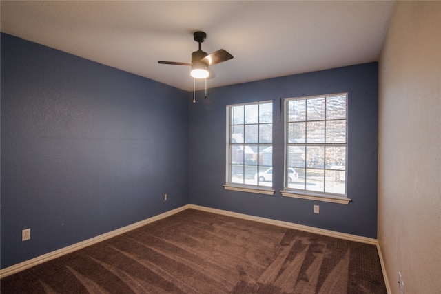 empty room featuring carpet flooring and ceiling fan