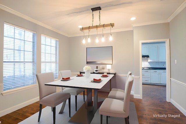 dining room with dark hardwood / wood-style flooring and ornamental molding