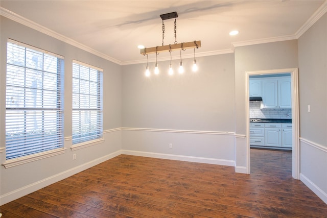 unfurnished room featuring ornamental molding and dark hardwood / wood-style floors