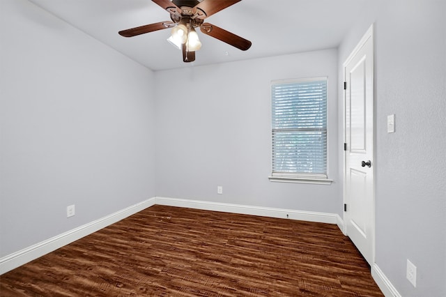 unfurnished room featuring ceiling fan and dark wood-type flooring