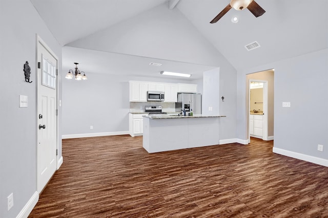 kitchen featuring white cabinets, dark hardwood / wood-style floors, ceiling fan with notable chandelier, and appliances with stainless steel finishes