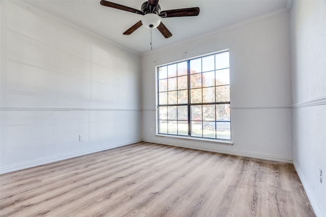 spare room featuring ceiling fan, light hardwood / wood-style floors, and ornamental molding