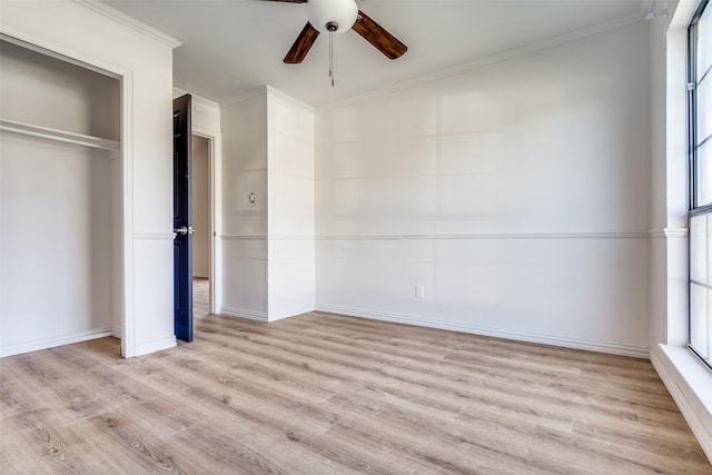 unfurnished bedroom with light hardwood / wood-style floors, multiple windows, and ceiling fan