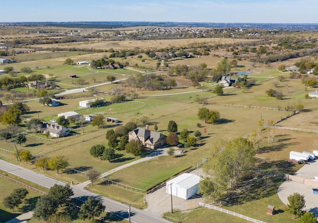 birds eye view of property featuring a rural view