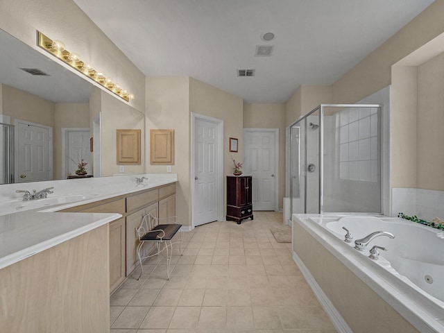 bathroom with tile patterned flooring, vanity, and independent shower and bath