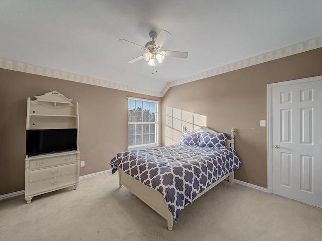 bedroom with a ceiling fan, carpet, and baseboards