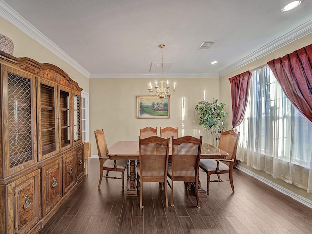 dining space with crown molding, visible vents, and dark wood finished floors