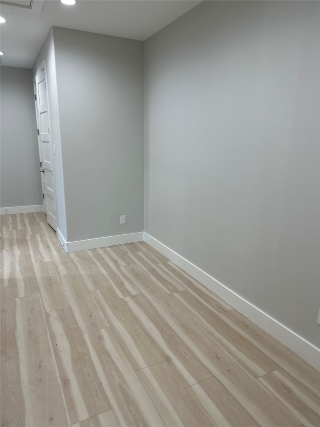 unfurnished room with light hardwood / wood-style flooring