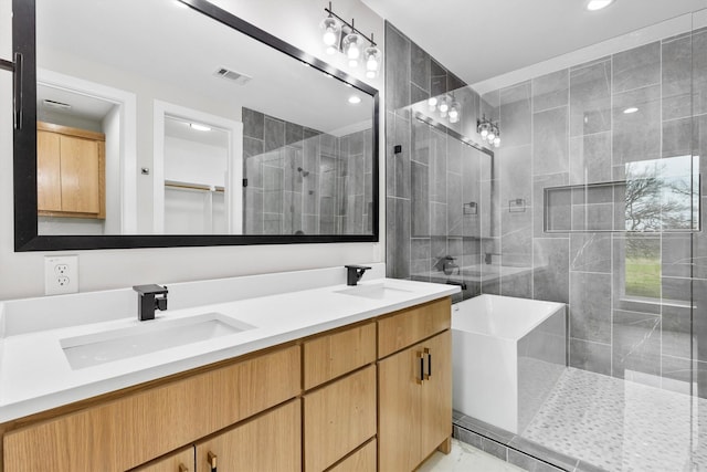 bathroom featuring an enclosed shower and vanity