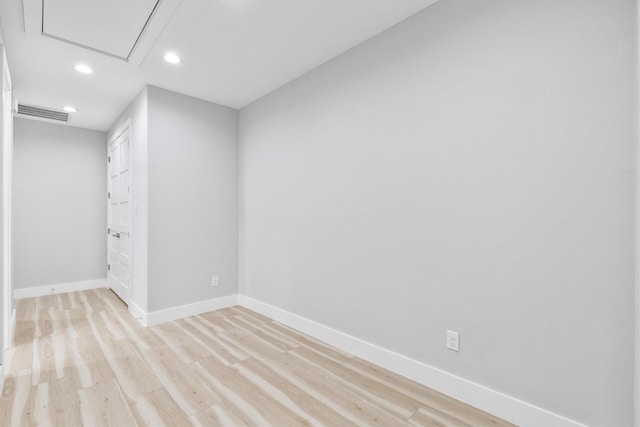 unfurnished room with light wood-type flooring