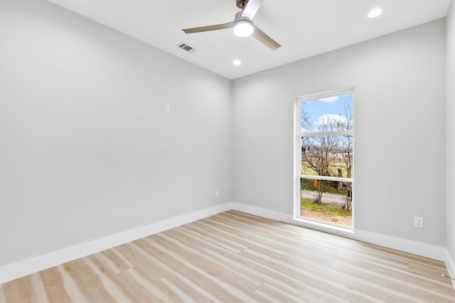 unfurnished room with ceiling fan and light hardwood / wood-style flooring