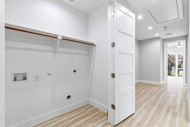 washroom with hookup for a gas dryer, electric dryer hookup, washer hookup, and light wood-type flooring