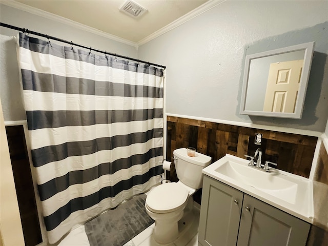 bathroom with ornamental molding, toilet, vanity, and wood walls