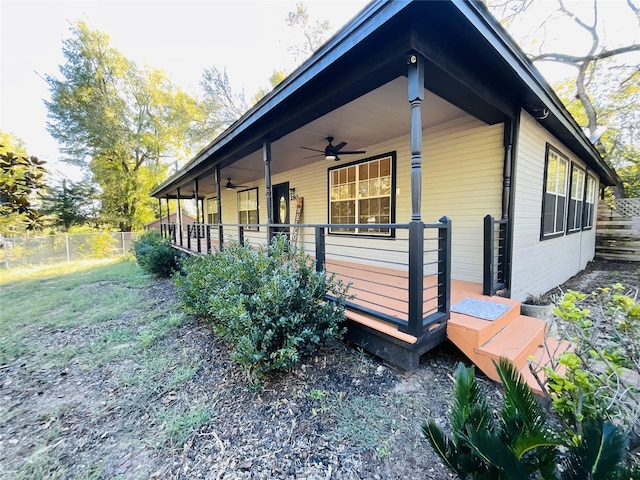 view of property exterior featuring ceiling fan