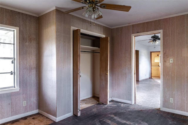 unfurnished bedroom featuring ornamental molding, a closet, and ceiling fan